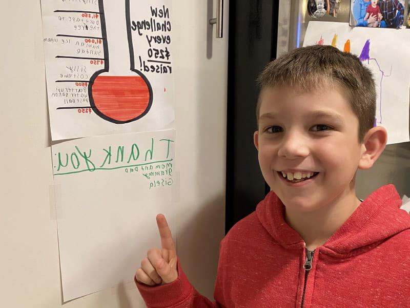 Mason McElhinney, shown tracking his goal in the 2022 Kids Heart Challenge, says it warms his heart to know his efforts can help children who have heart disease. (Photo courtesy of Casey McElhinney)